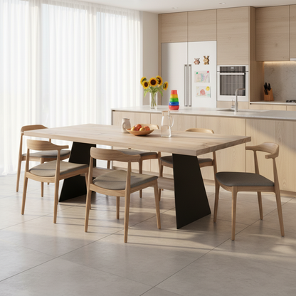 Rustic gray oak dining table by Wildwuchs-Möbel with sturdy wooden crossbeams and metal legs, showcasing natural wood grain.