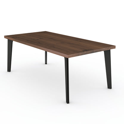 Rustic brown oak dining table by Wildwuchs-Möbel with a solid steel hollow leg design, showcasing a natural wood finish.