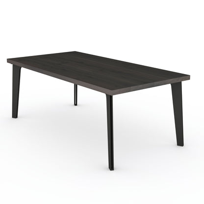 Rustic black oak dining table with solid steel hollow leg by Wildwuchs-Möbel, showcasing a sleek and modern design.