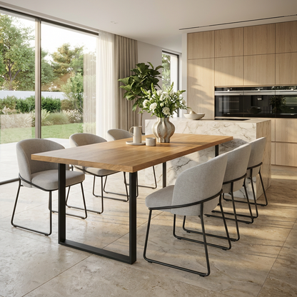 Premium natural oak dining table with U-shaped legs by Wildwuchs-Möbel, showcasing a sleek and modern design.
